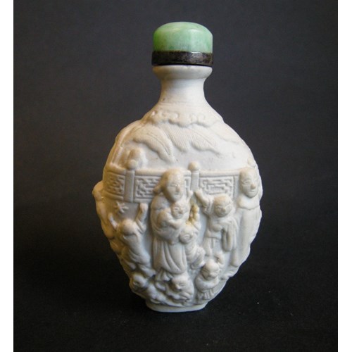 Biscuit porcelain snuff bottle sculpted with ladys and childrens
